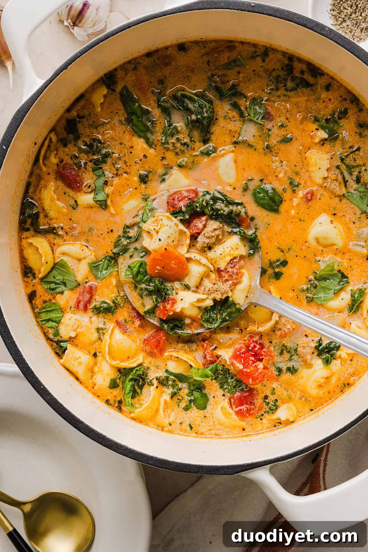 This Creamy Tortellini Soup is cozy, comforting and made with tender cheese tortellini, fresh veggies, herbs and a rich creamy broth. The perfect one pot meal that is both flavorful and satisfying!