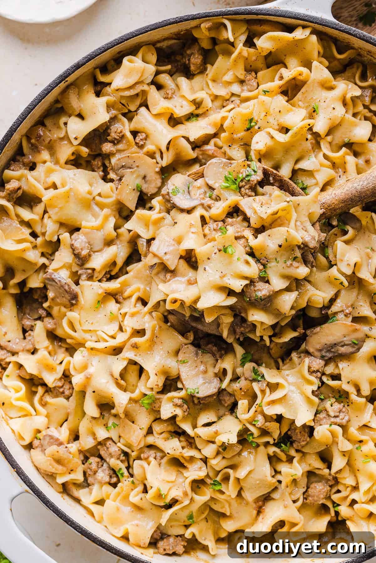 This Healthy Ground Beef Stroganoff Casserole is the ultimate family-friendly comfort food! The perfect cozy weeknight meal made with egg noodles and smothered in the most delicious creamy mushroom sauce in just 30 minutes!